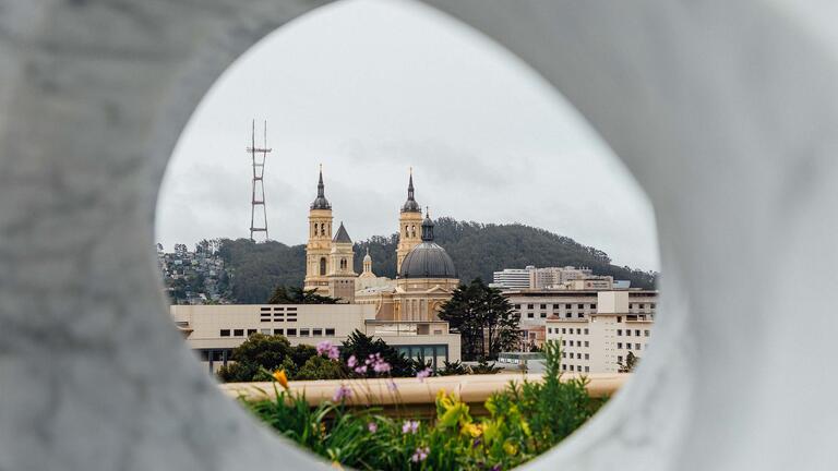 St Ignatius Church seen through a sculpture on Lone Mountain.