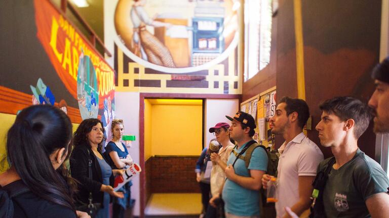 Students tour a colorful part of the history of the Mission district.