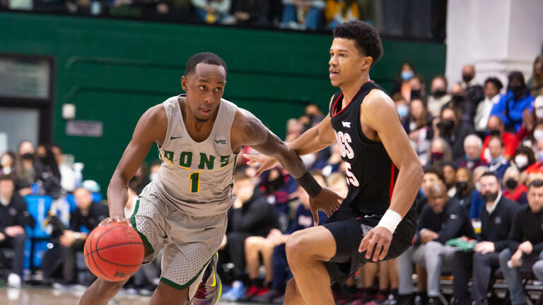 USF basketball player dribbles.
