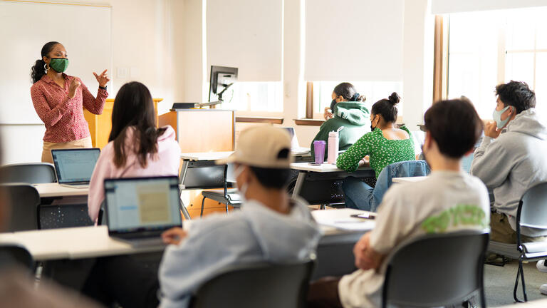 Full class of students listen to a lecture.