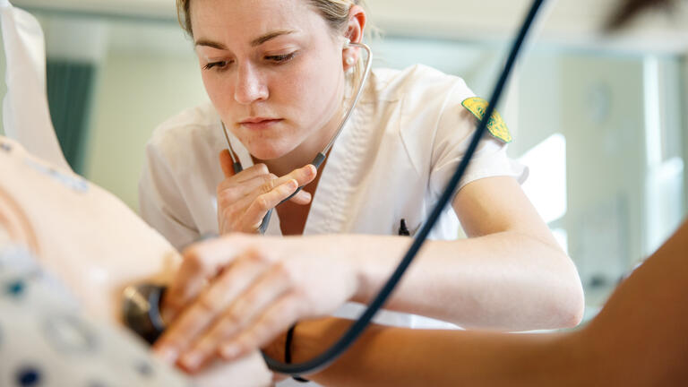 student in the sim lab