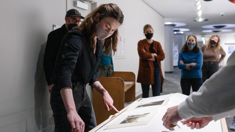 installing art exhibit in thacher gallery