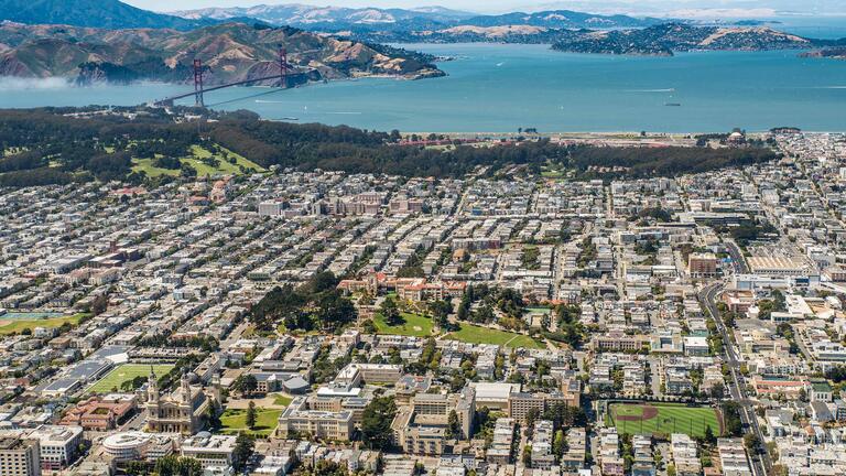 Aerial view of USF with Golden Gate in the background.