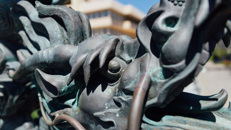 Close up view of dragon statue on lawn