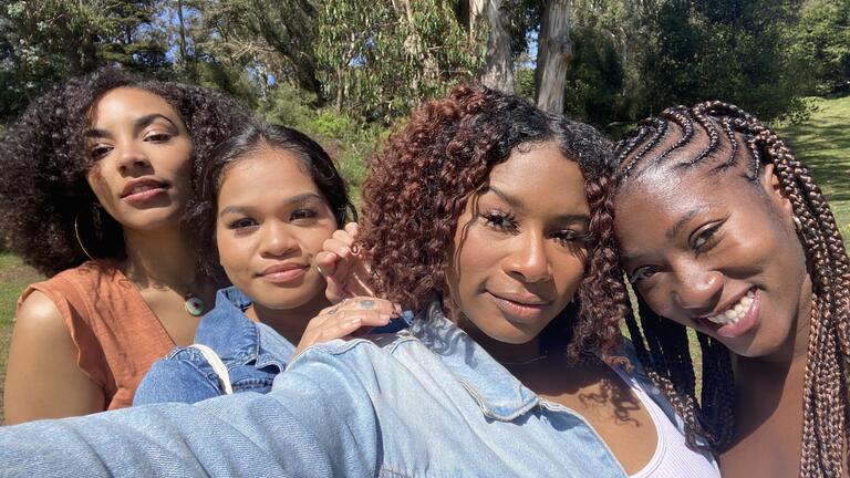 Emaya White, in denim jacket, with friends at USF