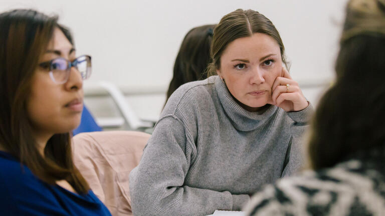 Student listens intently to an instructor.