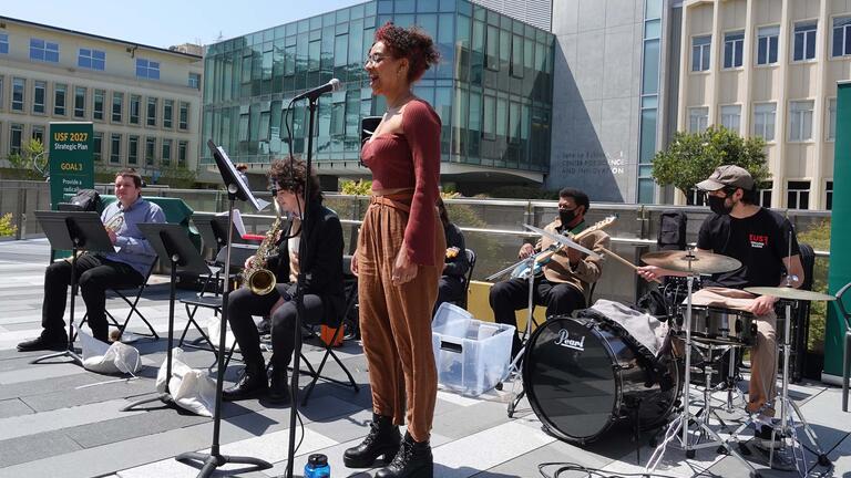 Singer and band perform in the quad.