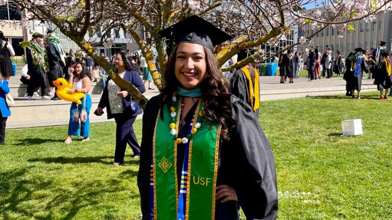 Yaretzie Amaya MA '21 stands in front of a tree