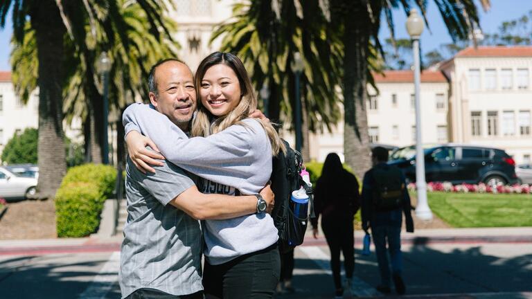 Parent and student embrace