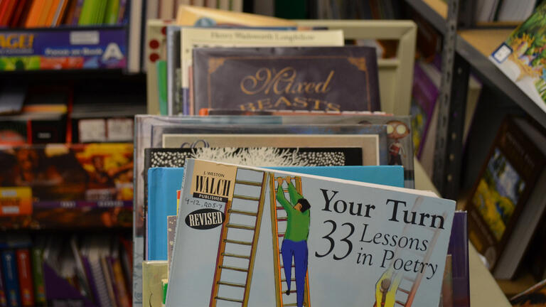 Books in a stack on a library cart