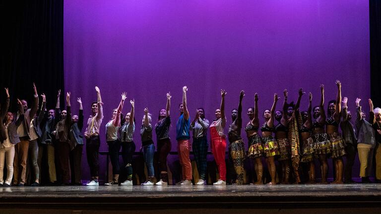 Students take a bow at the end of a performance