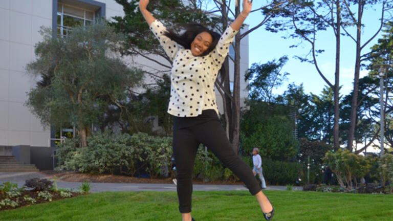 Breniel Lemley jumping with joy on USF's campus