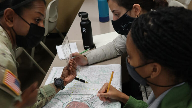 ROTC looking at a map