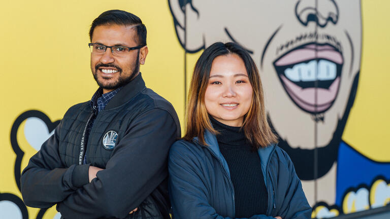 students in front of mural