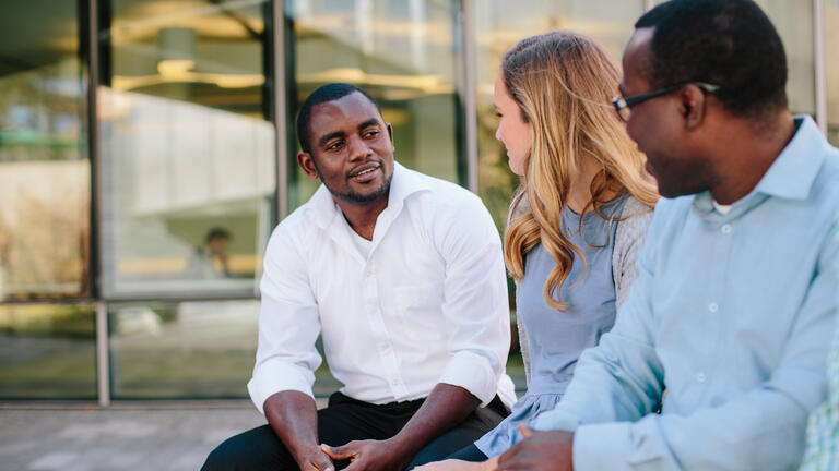 students talking outside