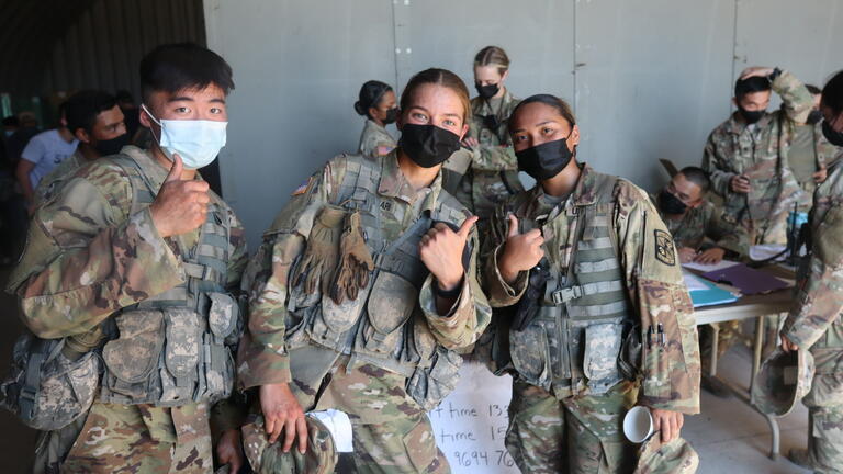 army students hanging outside