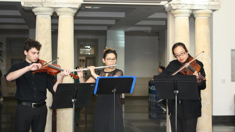 Chamber musicians perform in the Kalmanovitz Hall Atrium 