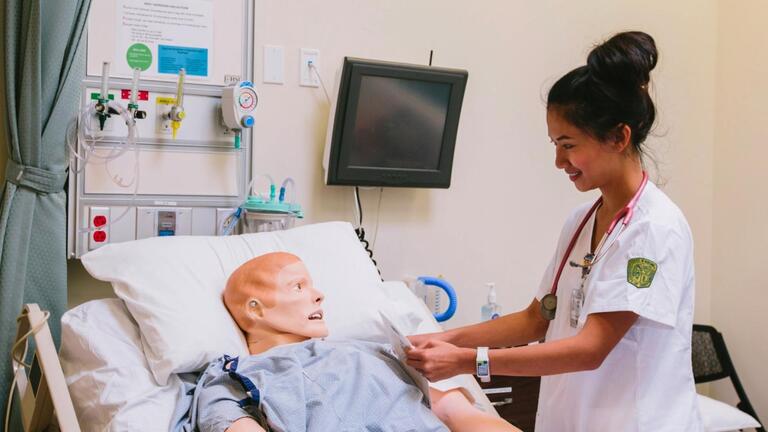 Nursing student practicing skills
