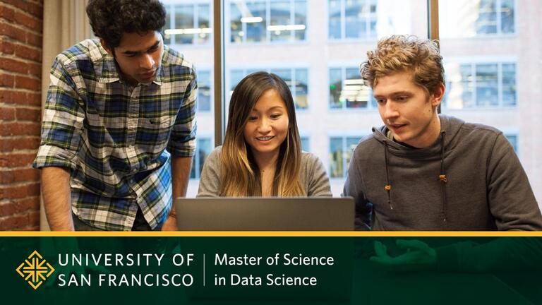 Data Science students working together on a laptop.
