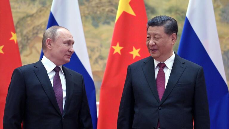 Heads of State against a backdrop of state flags