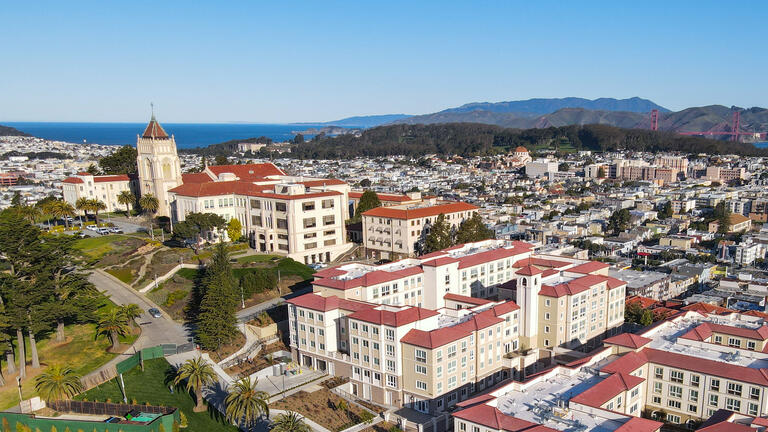 Lone Mountain Dining and Residence Hall with Golden Gate Bridge in background