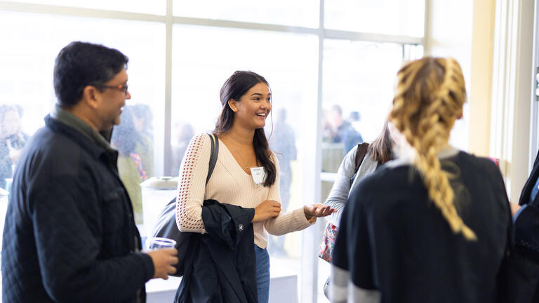 student smiles while speaking