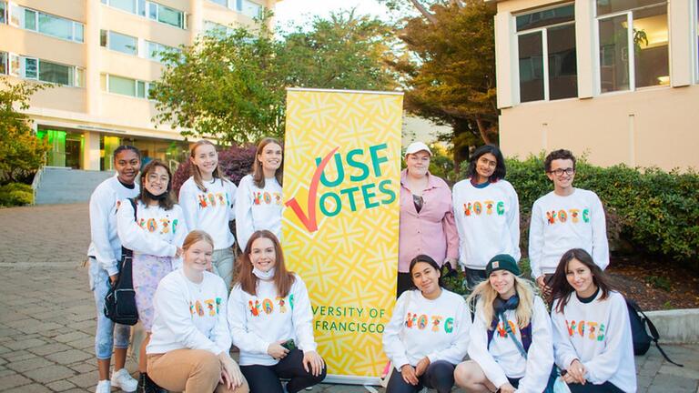 photos of students in front of USFVotes sign 