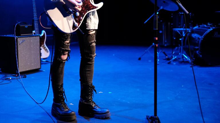 student musician playing guitar