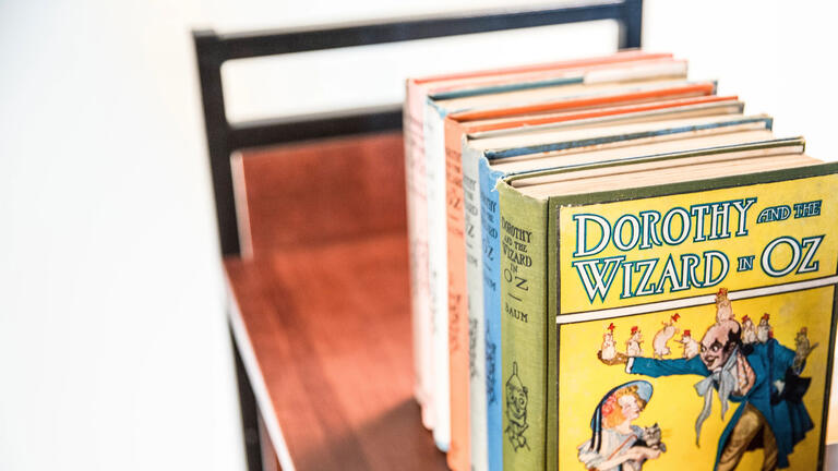 Wizard of Oz rare books on a cart