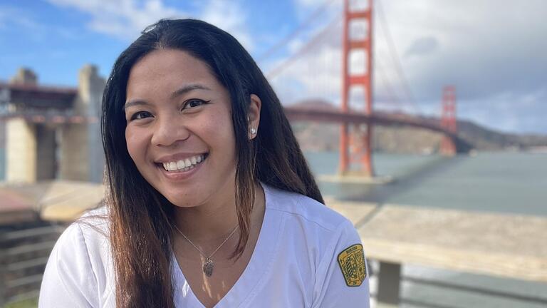 Photo of Sunshine Joyce Batasin in front of Golden Gate Bridge