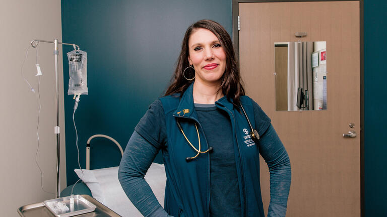 Laura Sabin poses in a hospital room