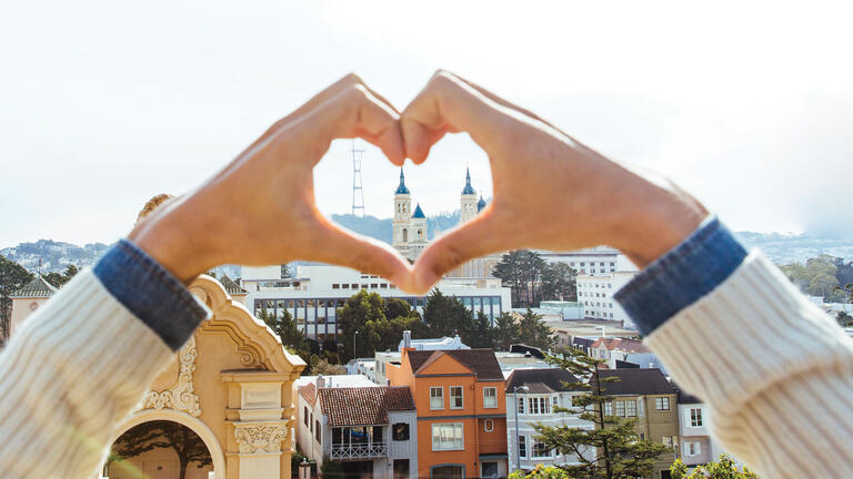 Hands form heart around St. Ignatius Church