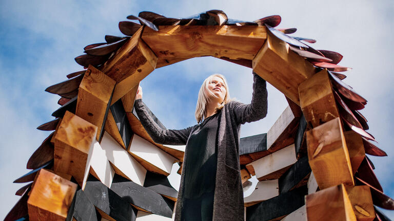 Person posing inside an art installation