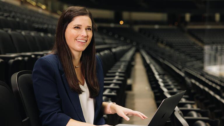 USF Student with a laptop at Honda Center