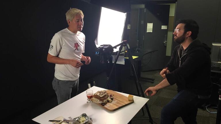 Staff member set up a photo shoot of bread for the issue cover
