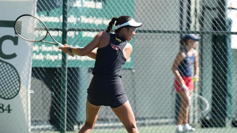 Player Alicia Yue preparing to hit a backhand 