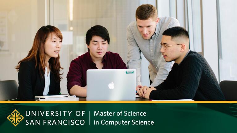Students working at a computer with USF Computer Science logo. 