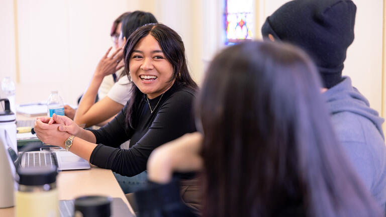 student talking and laughing in classroom