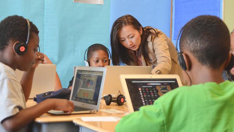 USF alumna teaching a grade school class