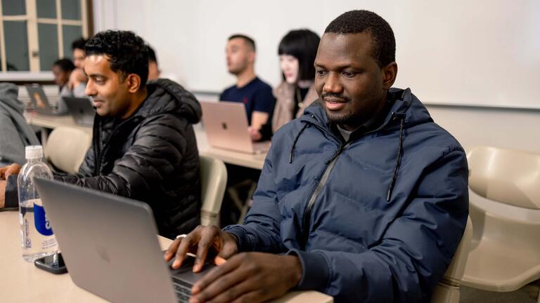 USF students working on their laptops