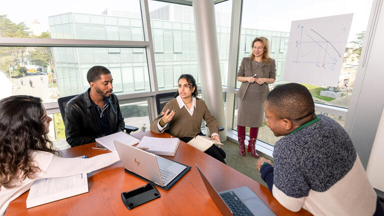 student speaking to others in class