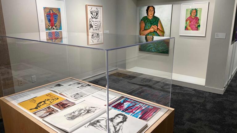 Installation view featuring (left to right on walls) Guadalupe: Woman Goddess, 1978; Who’s the Illegal Alien, PILGRIM?, 1978; and My Mother, 1974