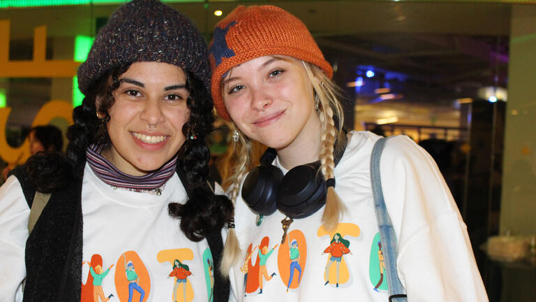 two students wearing vote shirts