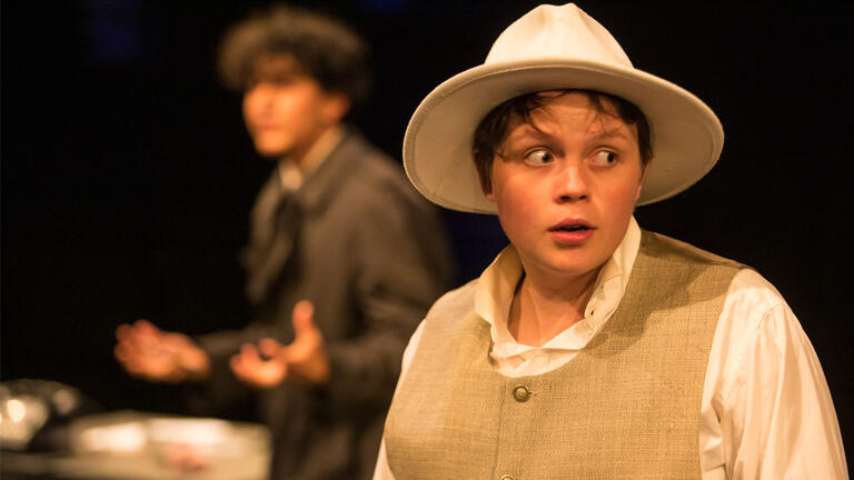 a nervous person is shadowed by a mysterious fellow during a play