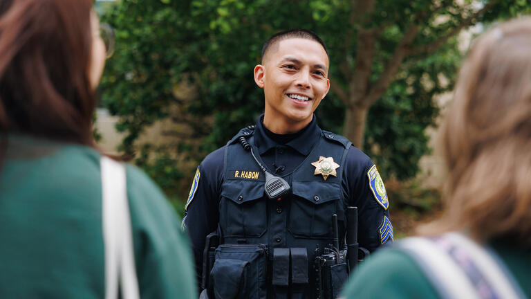 Public Safety officer speaks to students.