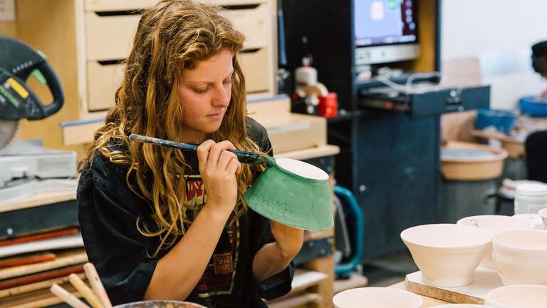 USF student working on pottery