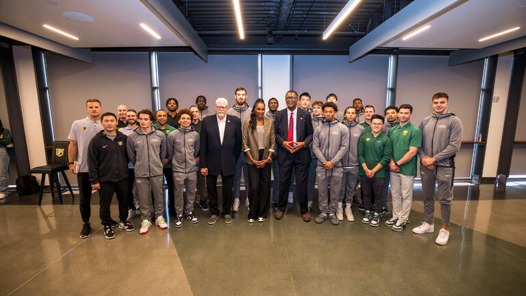 Phil Jackson, Bill Cartwright, and Lisa Leslie with student athletes