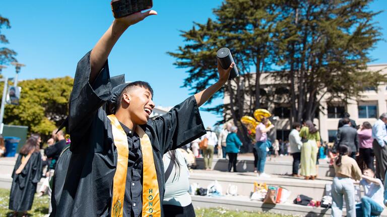 student celebrating during commencement ceremony