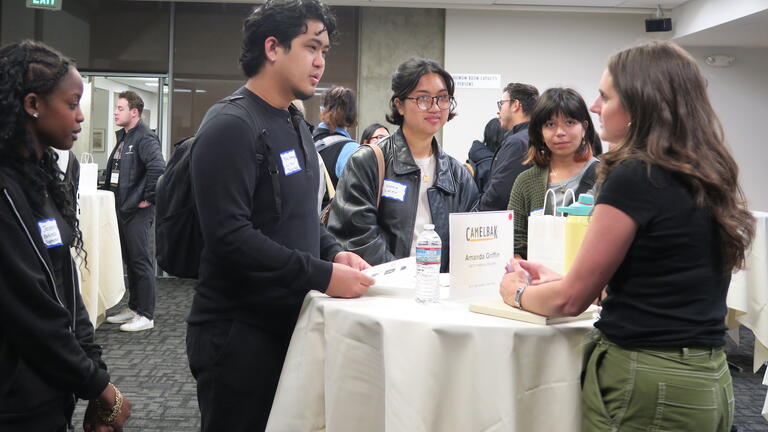 Students talk with Camelbak rep