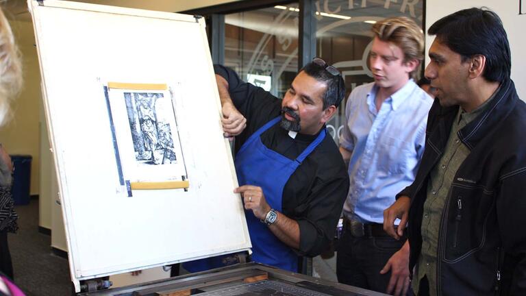 Person demonstrating a printing technique